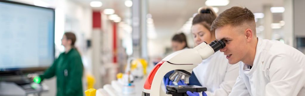 Scientific laboratory equipment and research papers illustrating proper lab report structure
